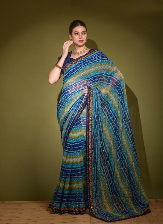 Blue Georgette Foil Print Saree With Heavy Sequins And Diamond Pattern Lace Border